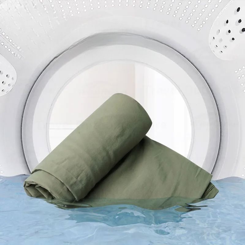 drap de sac de couchage dans laveuse