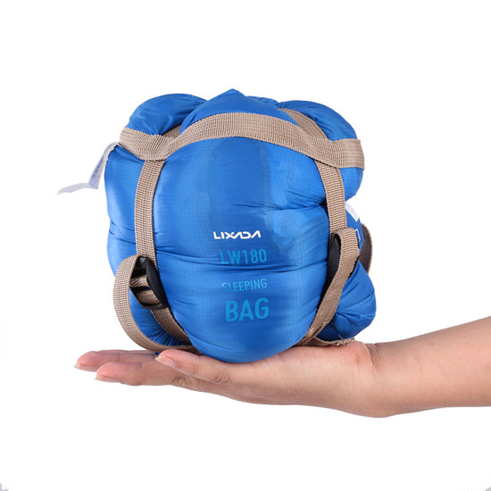 sac de couchage été bleu compressé